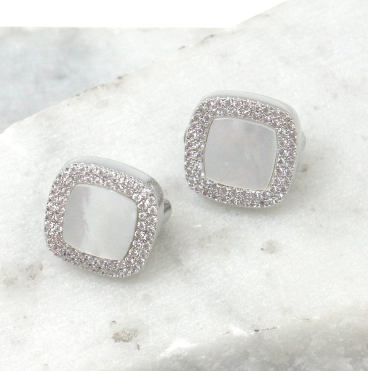A photo of the White Rhinestone Square Earrings product