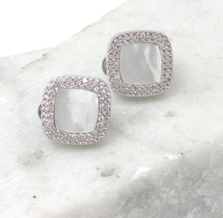 A photo of the White Rhinestone Square Earrings product