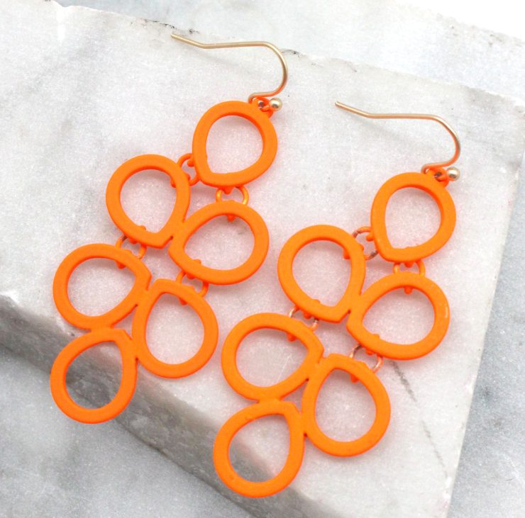 A photo of the Neon Comb Earrings product