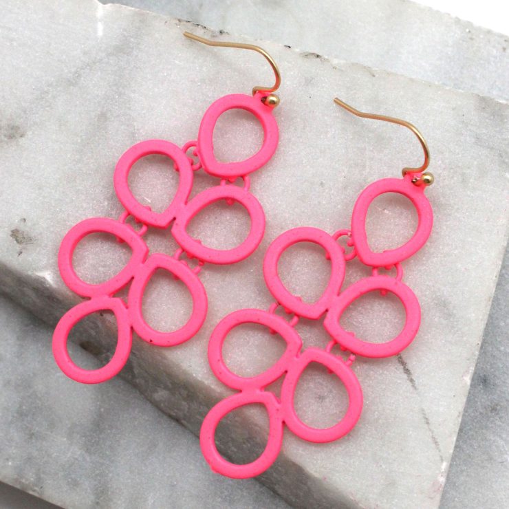 A photo of the Neon Comb Earrings product