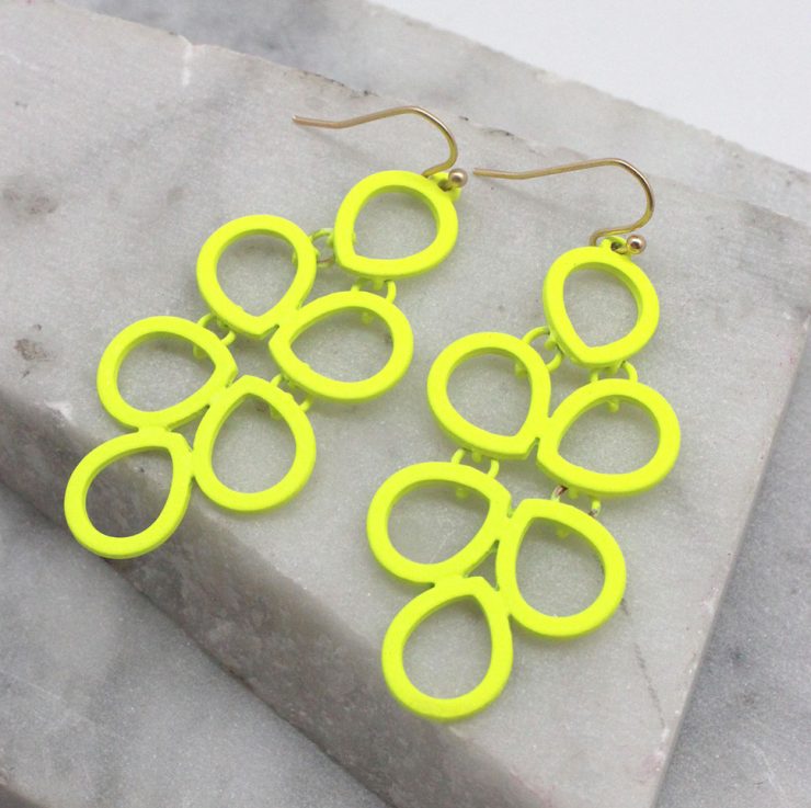 A photo of the Neon Comb Earrings product