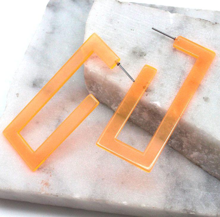 A photo of the Neon Lucite Rectangle Earrings product