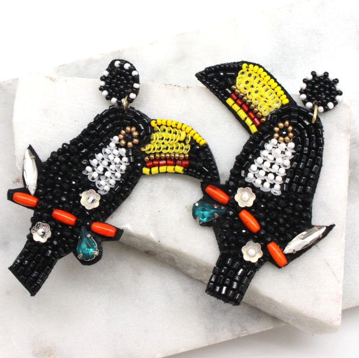 A photo of the Toucan Earrings product