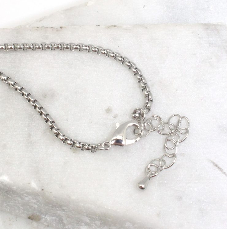 A photo of the Scribble Necklace product