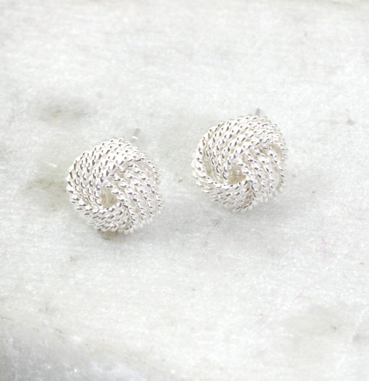 A photo of the Matte Love Knot Earrings product