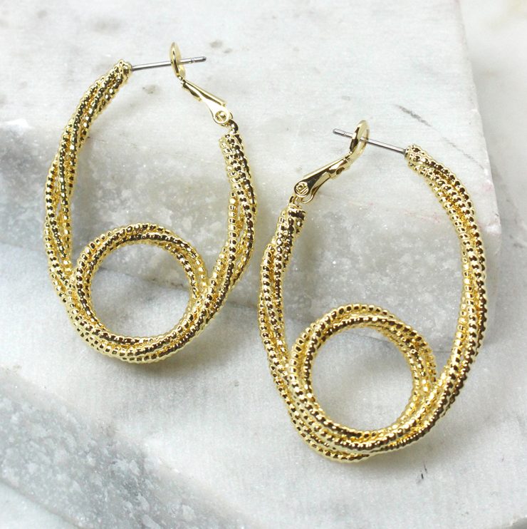 A photo of the Safety Pin Hoop Earrings product