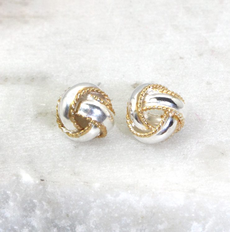 A photo of the Two Tone Love Knot Earrings product