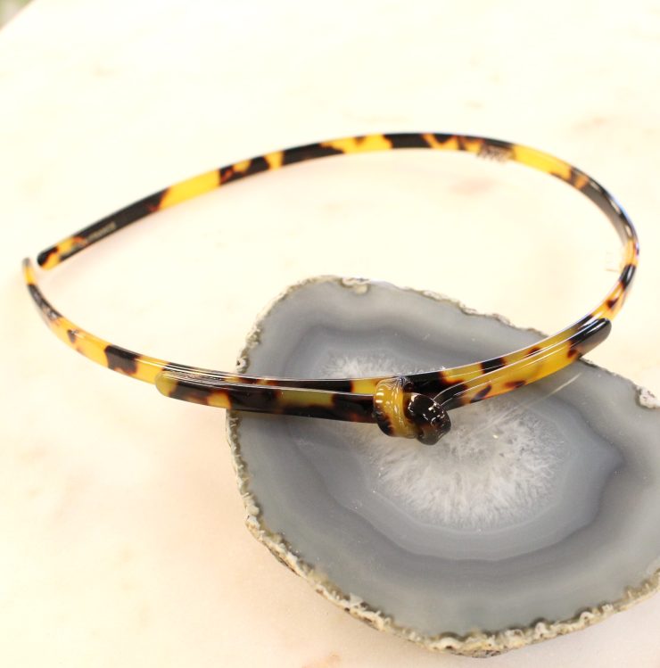 A photo of the Tortoiseshell Knot Headband product