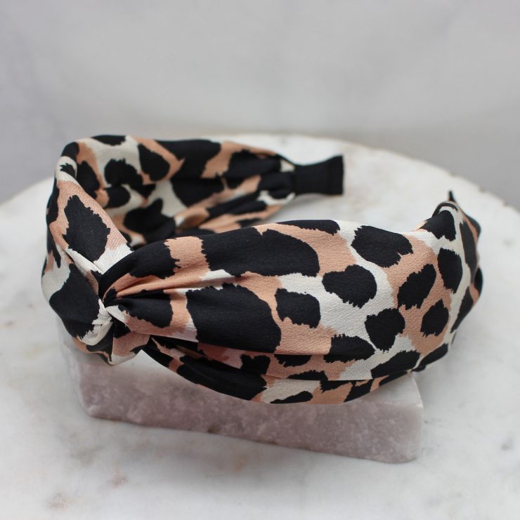A photo of the Ivory & Blush Leopard Headband product
