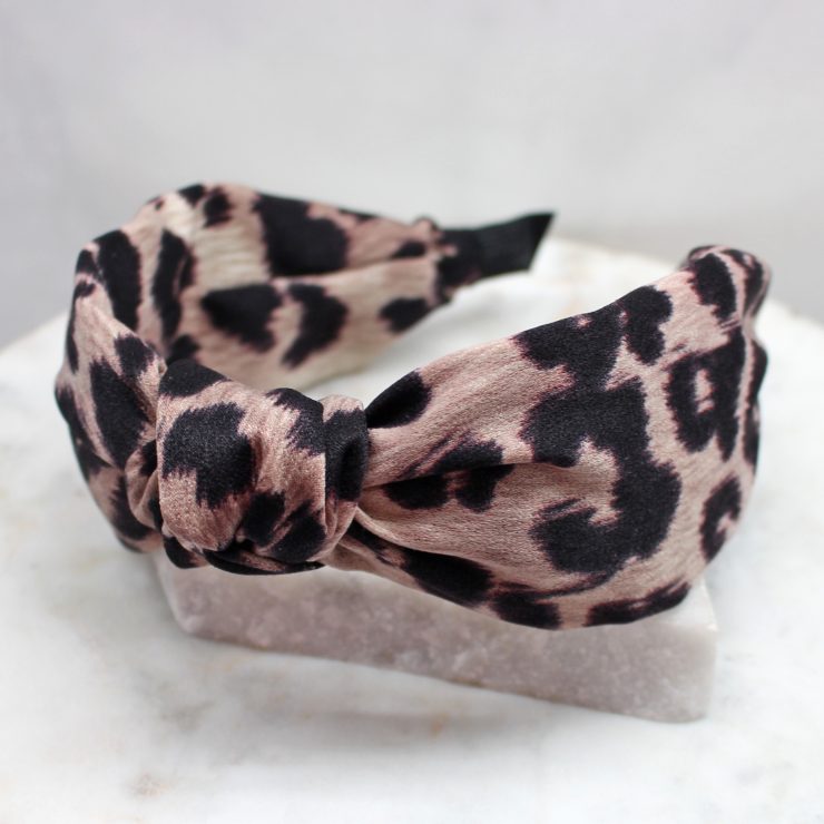 A photo of the Leopard Headband In Taupe product