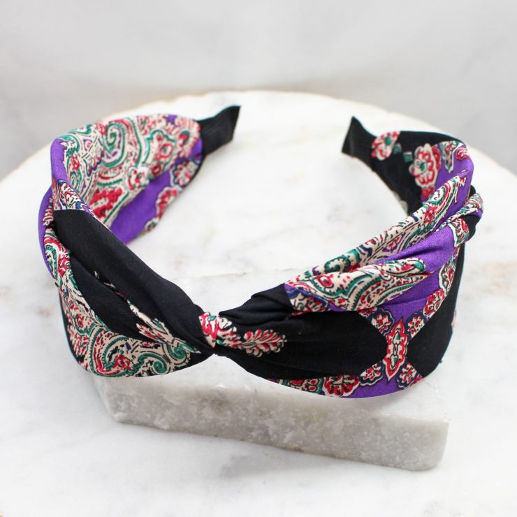 A photo of the Purple & Black Paisley Headband product