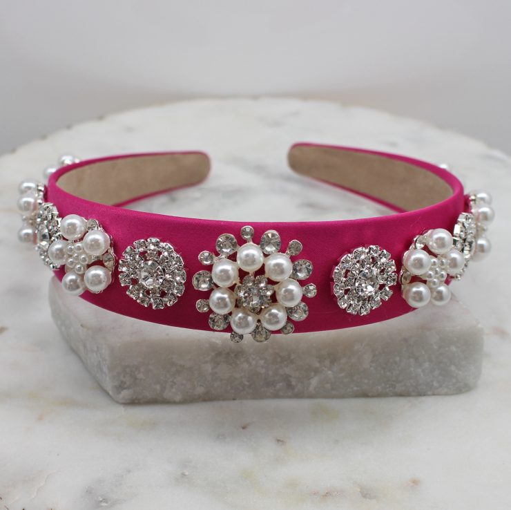 A photo of the Elegant Pearl Headband In Pink product