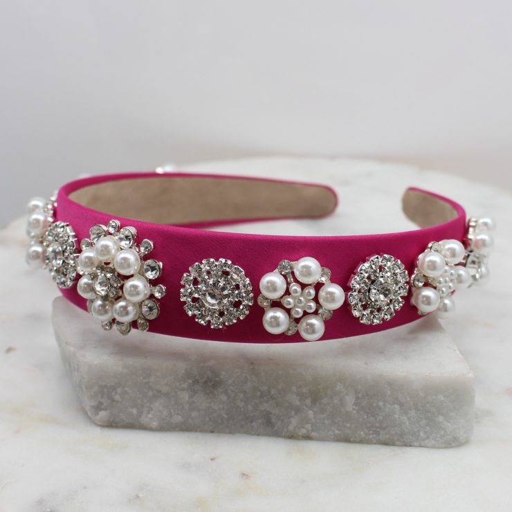 A photo of the Elegant Pearl Headband In Pink product