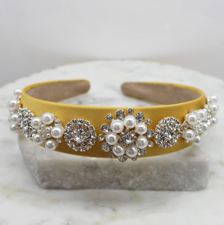 A photo of the Elegant Pearl Headband In Yellow product