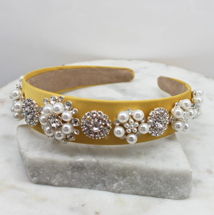 A photo of the Elegant Pearl Headband In Yellow product