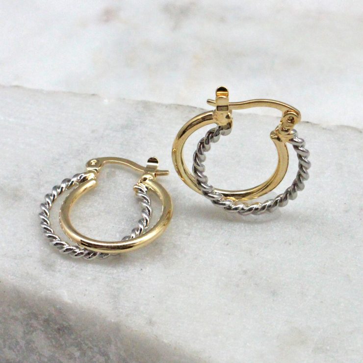 A photo of the Twisted Up Hoop Earrings product