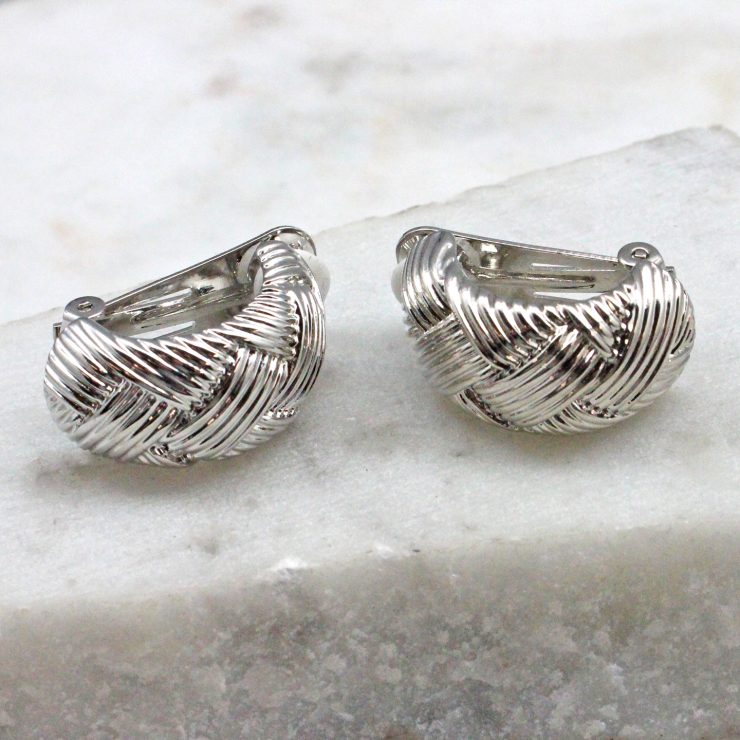 A photo of the Woven Clip On Earrings In Silver product