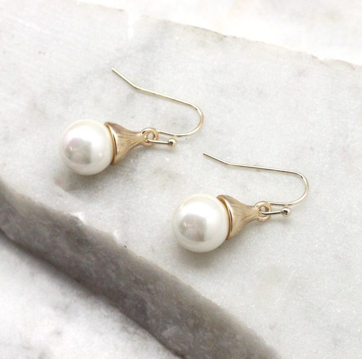 A photo of the Pearl Drop Earrings product