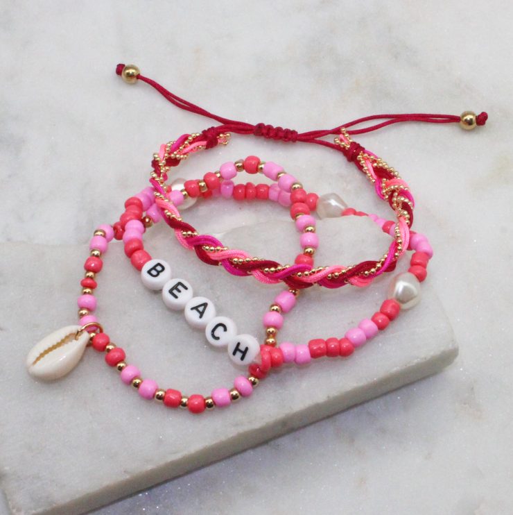 A photo of the Beach Stack Bracelets In Pink product