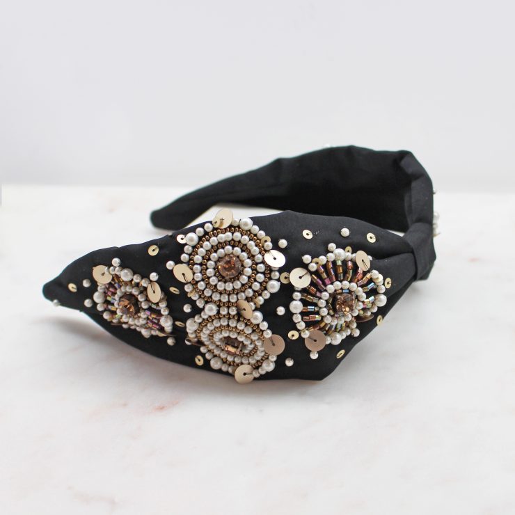 A photo of the Black & Gold Beaded Headband product