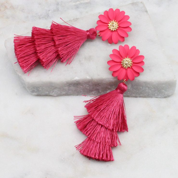 A photo of the Daisy Tassel Earrings In Pink product