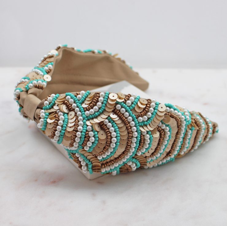 A photo of the Turquoise & Taupe Beaded Headband product