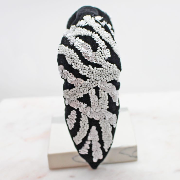 A photo of the Black & White Beaded Headband product