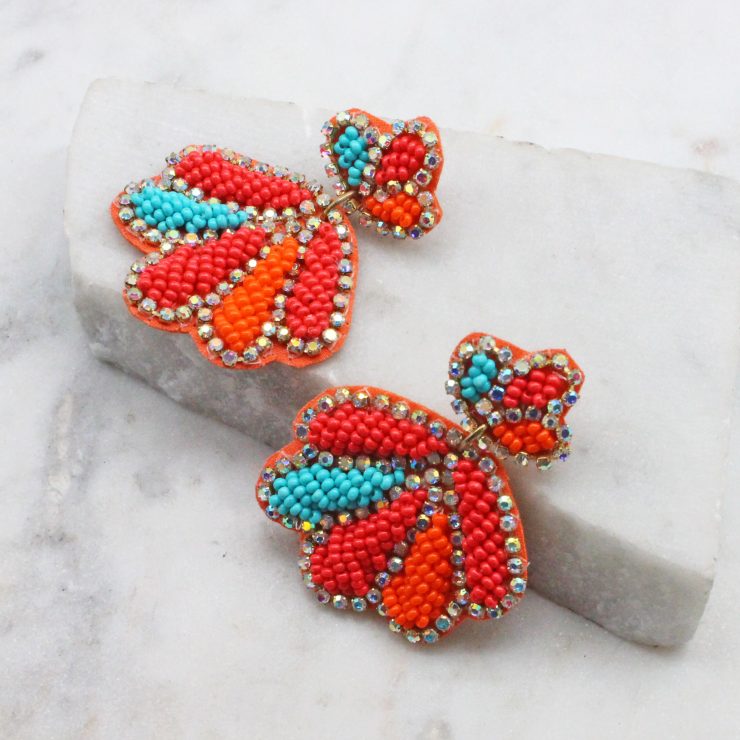 A photo of the Beaded Shell Earrings In Multi product