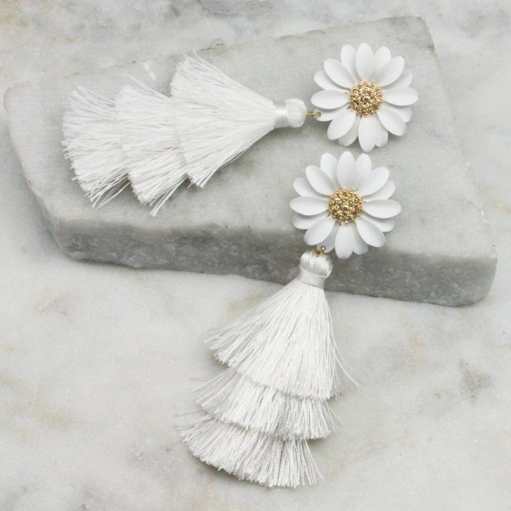 A photo of the Daisy Tassel Earrings In White product