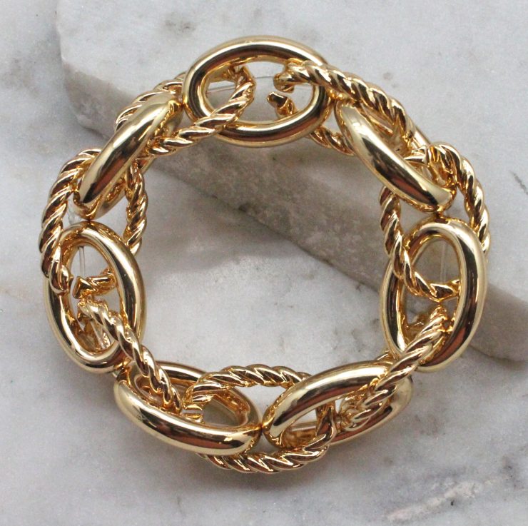 A photo of the Twisted Links Bracelet In Gold product