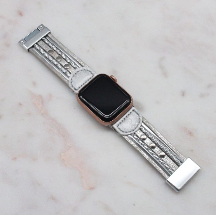 A photo of the Silver Faux Leather Apple Watch Band product