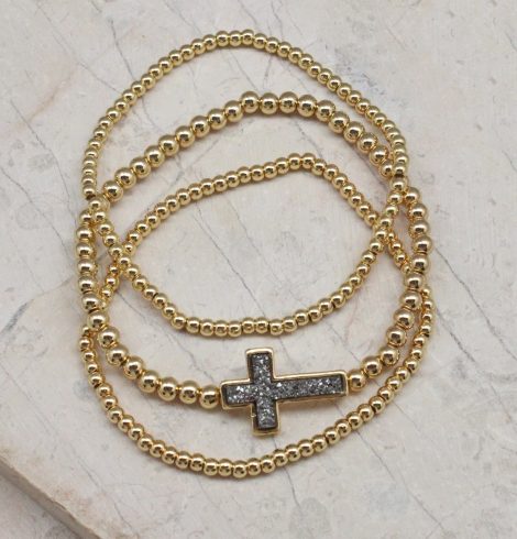 A photo of the Cross Beaded Stack Bracelet Set product