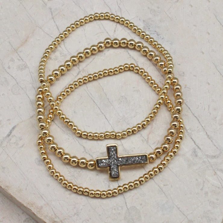 A photo of the Cross Beaded Stack Bracelet Set product