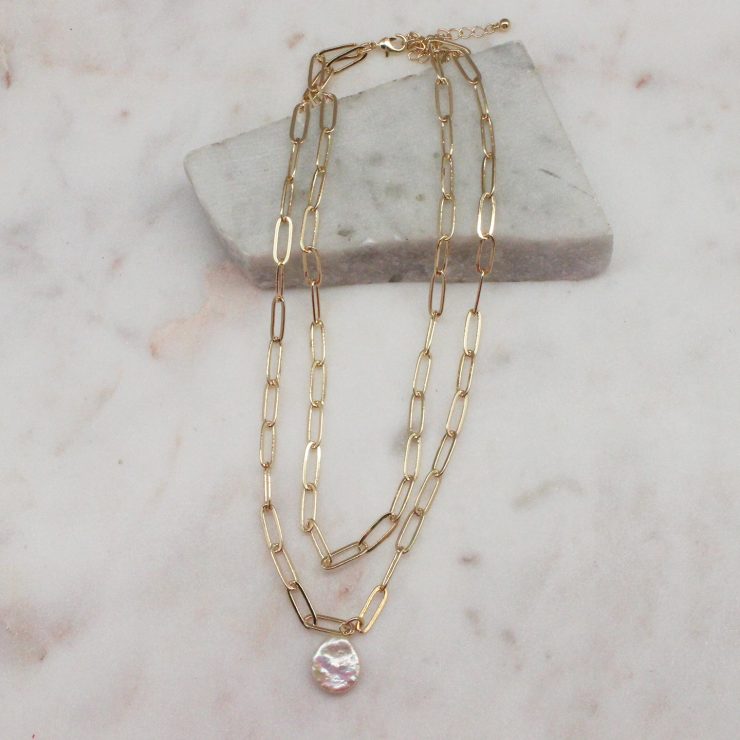 A photo of the Pretty Pearl Paper Clip Necklace In Gold product