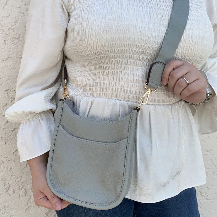 A photo of the Mini Messenger Bag In Light Grey product