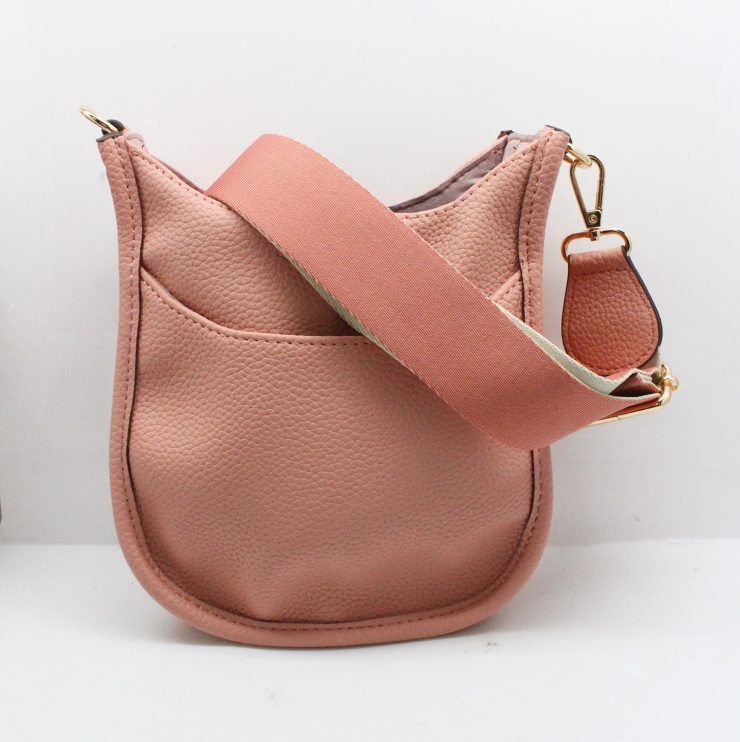 A photo of the Mini Messenger Bag In Light Pink product