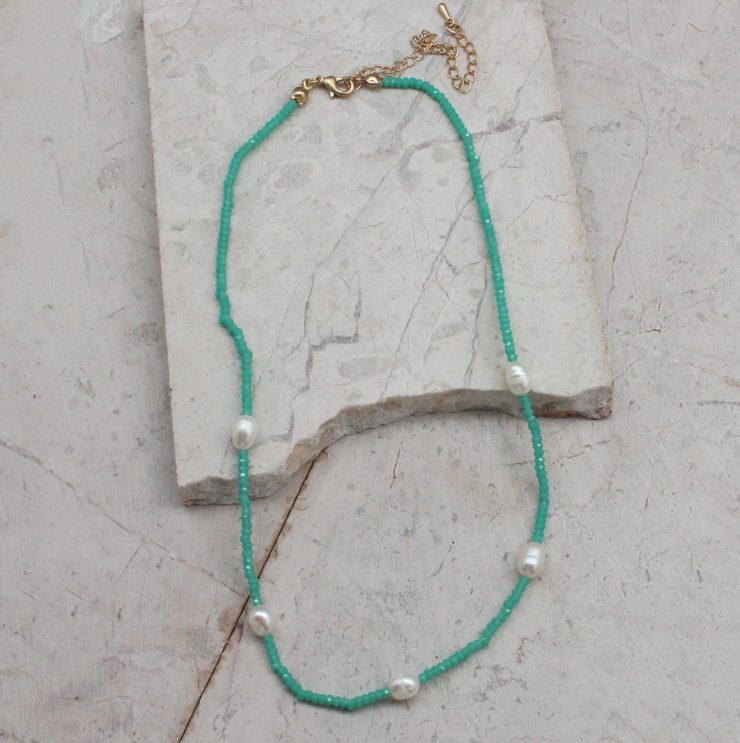 A photo of the Beaded Pearl Necklace In Mint product