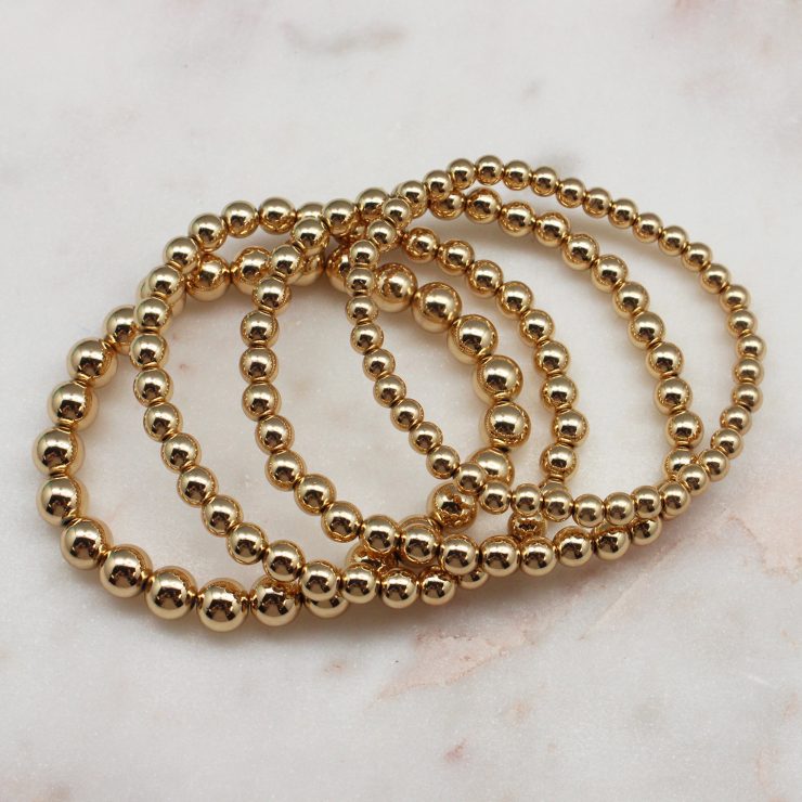 A photo of the Gold Beaded Bracelet Set Of 4 product