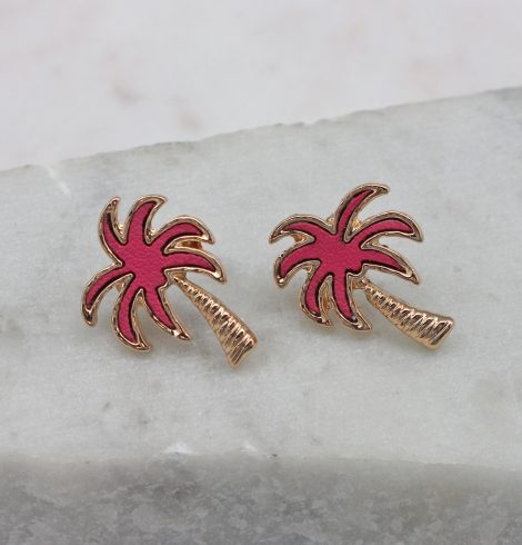 A photo of the Crescent Palm Earrings In Pink product