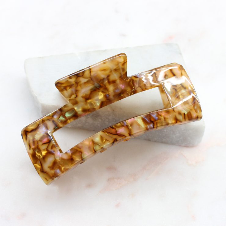 A photo of the Lola Jaw Clip In Brown product