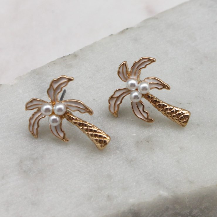 A photo of the Palm Tree Studs In White product