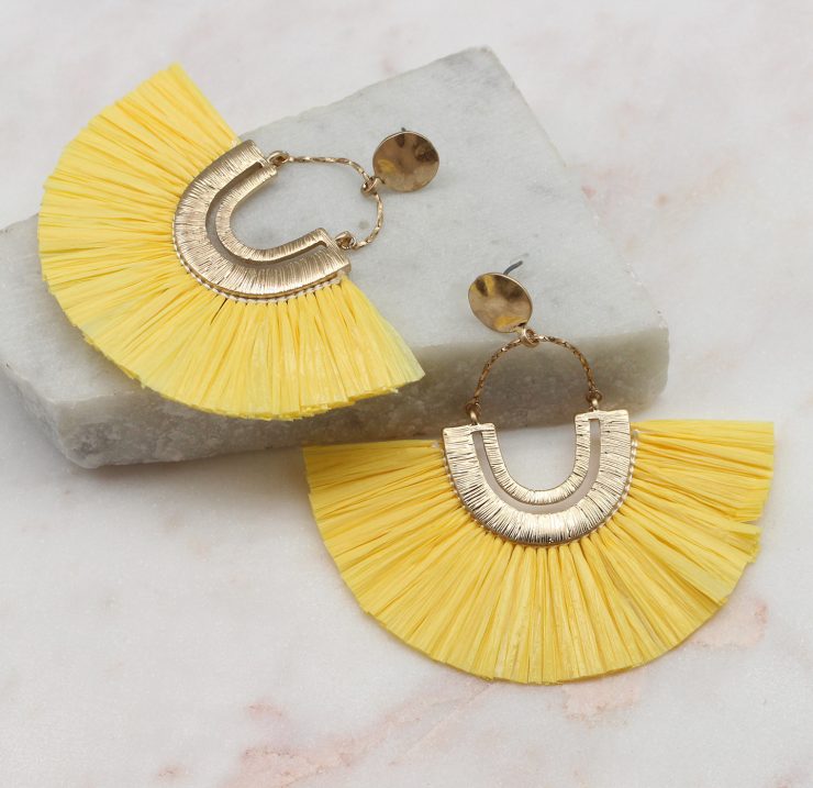 A photo of the Rita Raffia Earrings In Yellow product