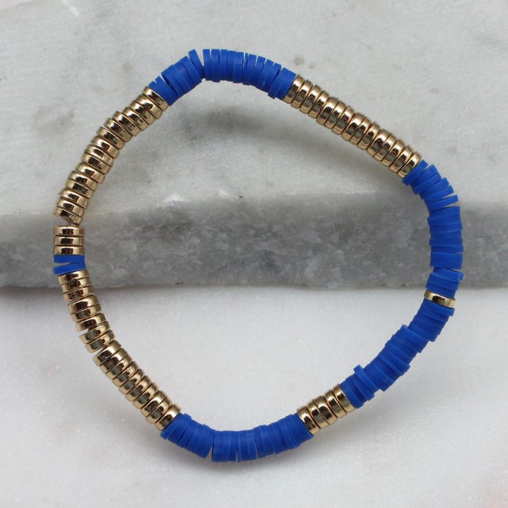 A photo of the Royal Blue & Gold Beaded Bracelet product