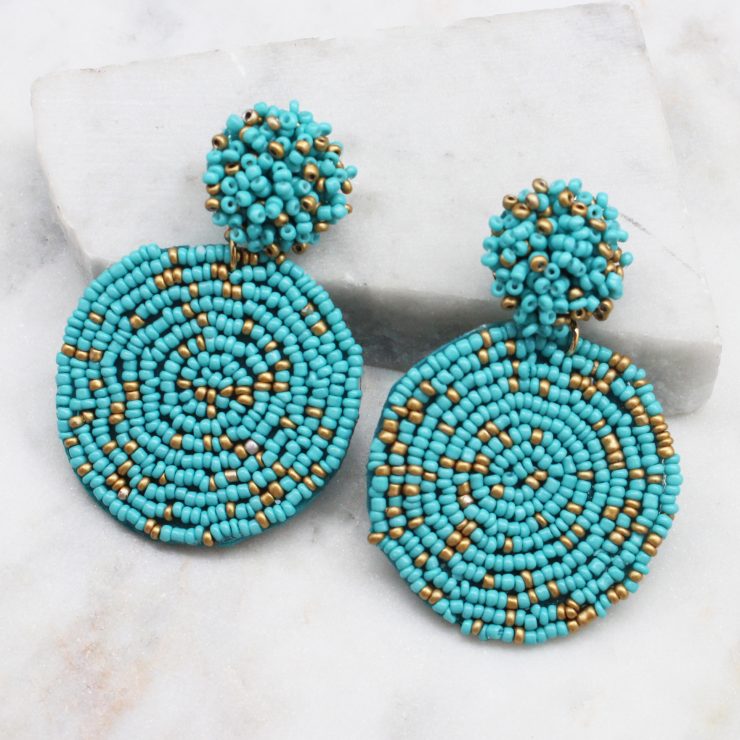 A photo of the Lizzy Earrings In Turquoise & Gold product