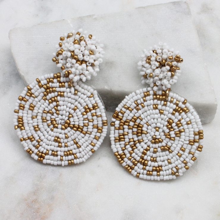 A photo of the Lizzy Earrings In White & Gold product