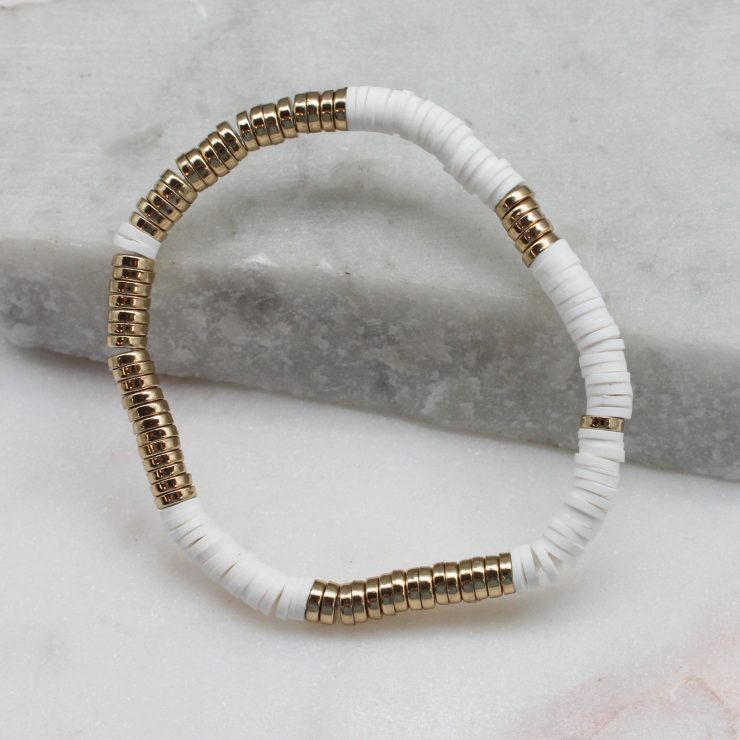 A photo of the White & Gold Beaded Bracelet product