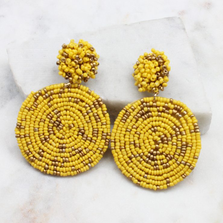 A photo of the Lizzy Earrings In Yellow & Gold product