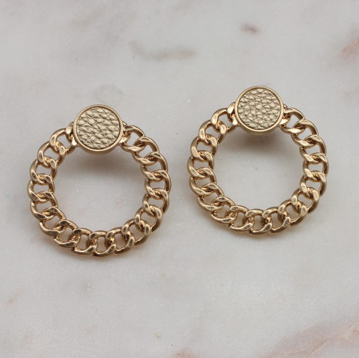 A photo of the Chained Earrings In Gold product