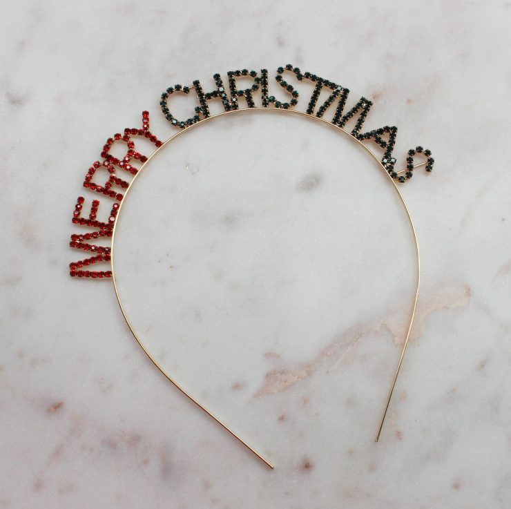 A photo of the Merry Christmas Rhinestone Headband product