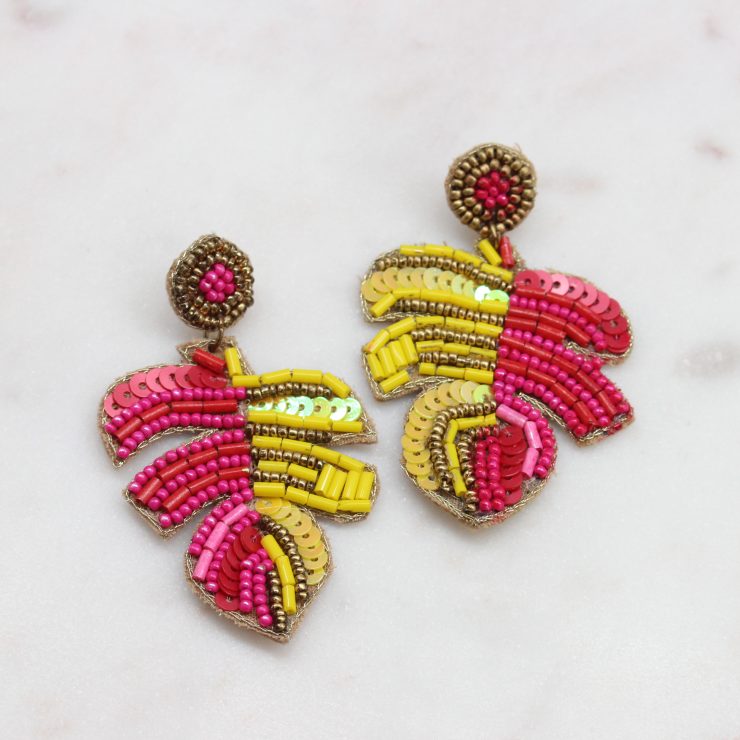 A photo of the Pink & Yellow Beaded Palm Earrings product